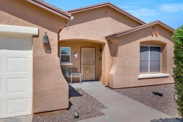 5897 E Cedarbird Dr, Tucson, AZ 85756 - entrance to property featuring stucco siding and a garage