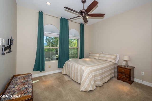 bedroom featuring ceiling fan, baseboards, recessed lighting, and light colored carpet