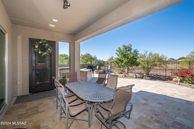 view of patio / terrace with a fenced backyard and outdoor dining space