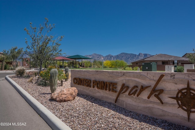 community sign featuring a mountain view