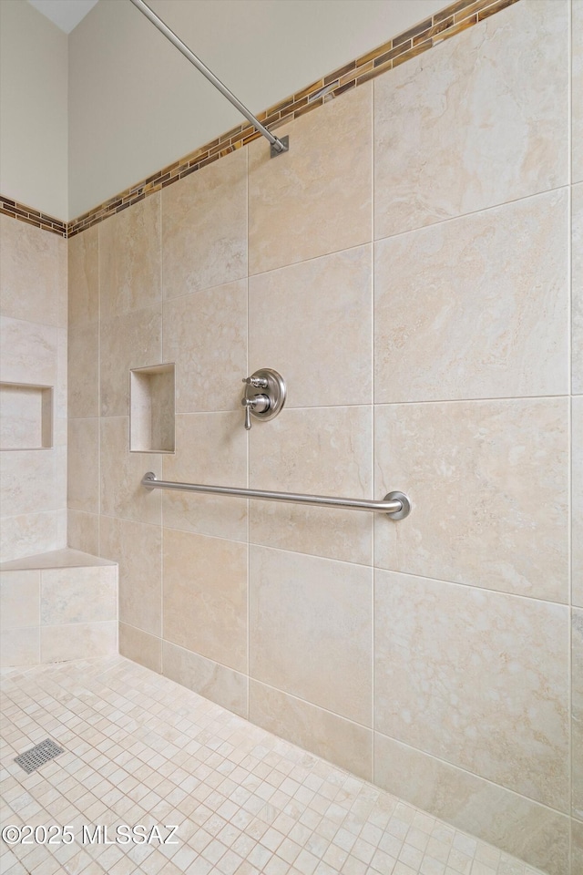 full bathroom with tiled shower