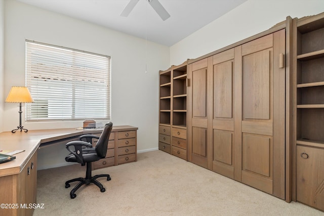 office space with light carpet and ceiling fan