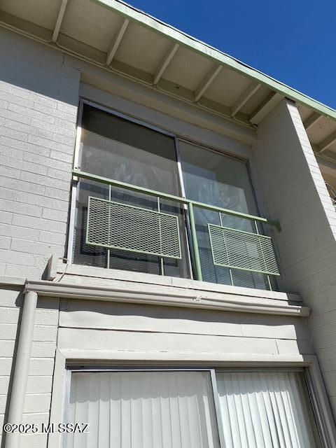 view of property exterior featuring concrete block siding