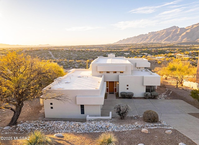 birds eye view of property with a mountain view