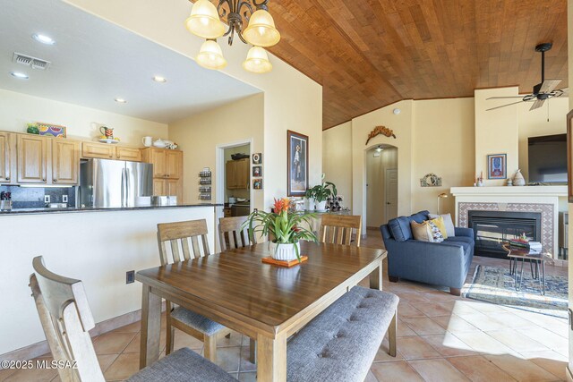 carpeted bedroom featuring a ceiling fan, visible vents, and baseboards