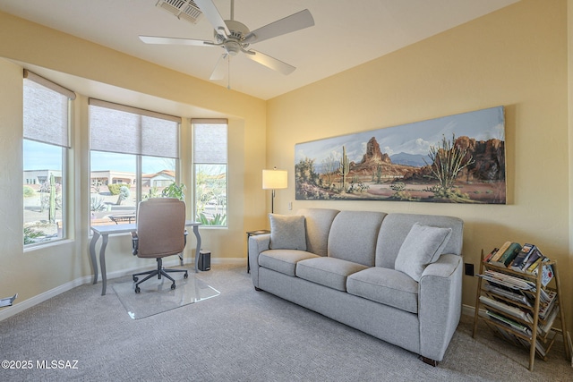 carpeted office space with visible vents, ceiling fan, and baseboards