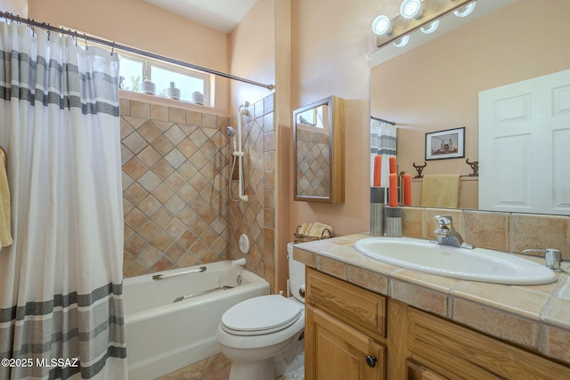 full bathroom featuring toilet, tile patterned flooring, shower / bath combo, and vanity