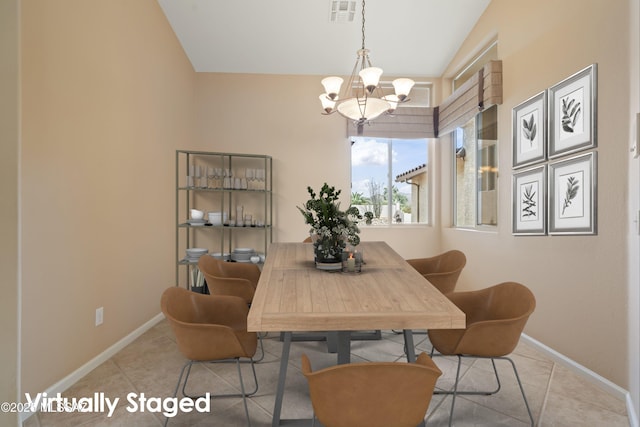 dining area with tile patterned flooring, baseboards, visible vents, and a notable chandelier