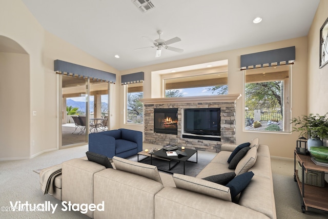 carpeted living room with a stone fireplace, recessed lighting, visible vents, baseboards, and vaulted ceiling