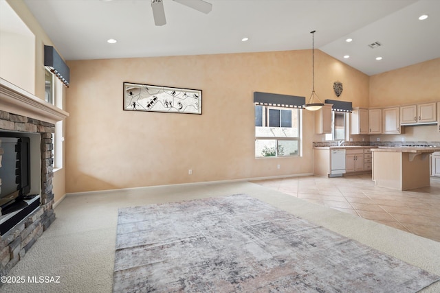 unfurnished living room featuring recessed lighting, light colored carpet, a ceiling fan, visible vents, and a glass covered fireplace