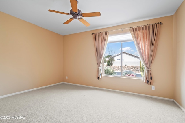 unfurnished room with ceiling fan, baseboards, and carpet flooring