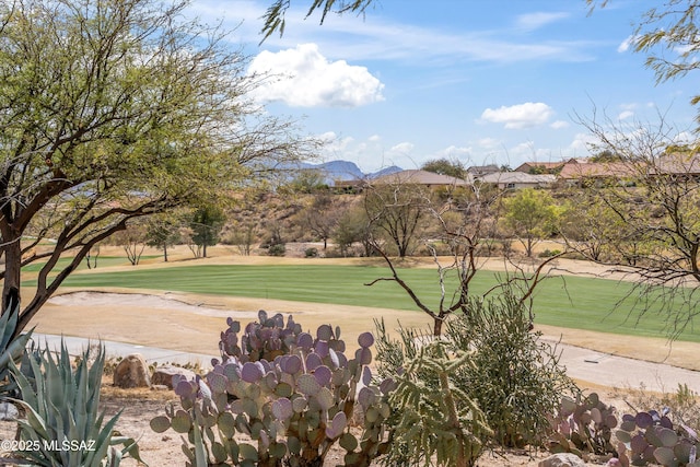 exterior space featuring a yard and golf course view