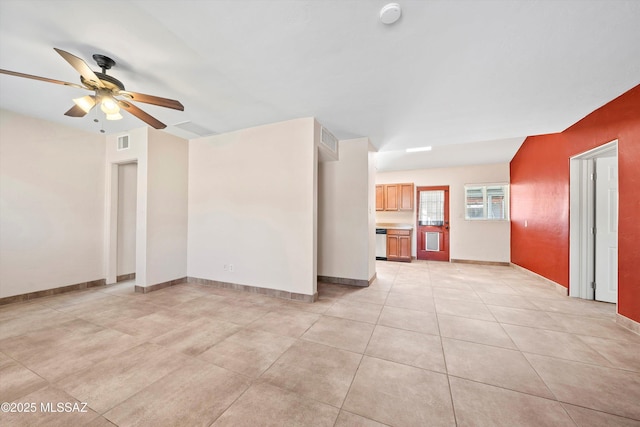 unfurnished room featuring baseboards, visible vents, a ceiling fan, and light tile patterned flooring