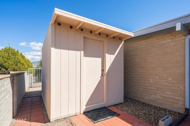 view of shed with fence