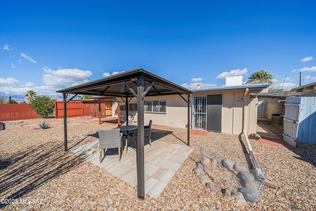 view of patio with a gazebo and a fenced backyard