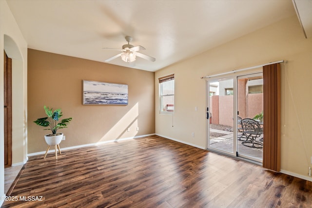 unfurnished room with ceiling fan, baseboards, and wood finished floors