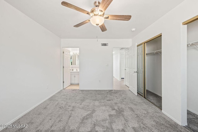 unfurnished bedroom with a ceiling fan, light colored carpet, visible vents, and baseboards