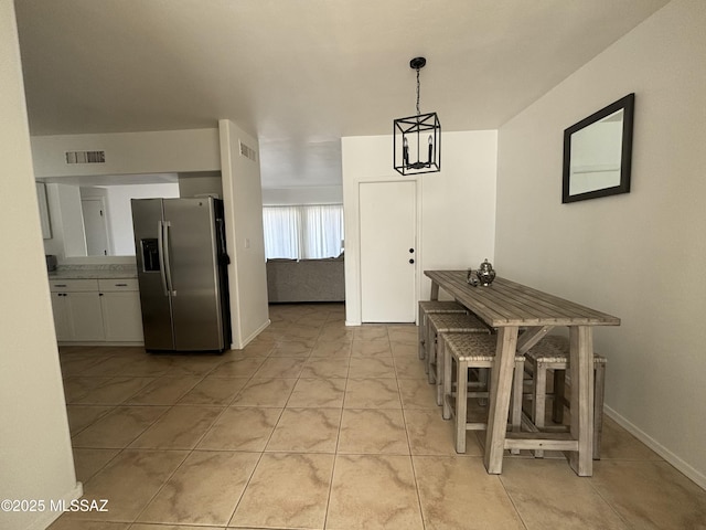 dining area featuring visible vents and baseboards