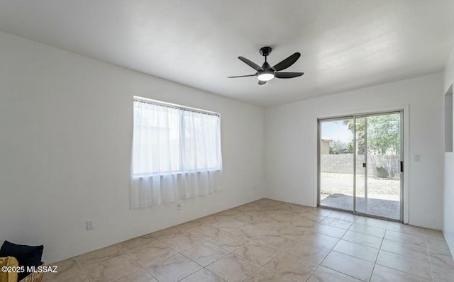 unfurnished room featuring ceiling fan