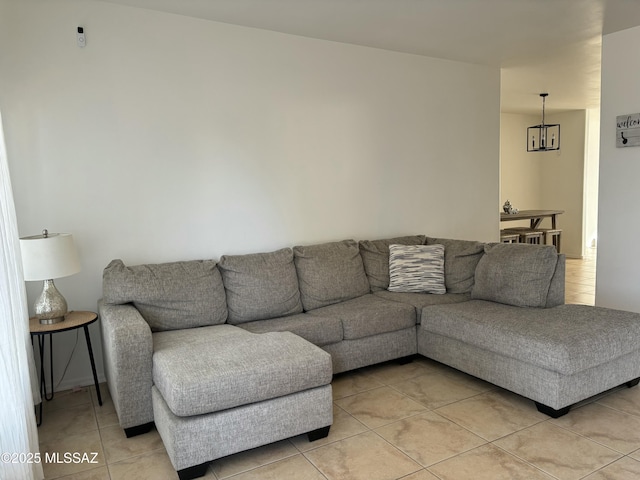 living room featuring light tile patterned floors and an inviting chandelier