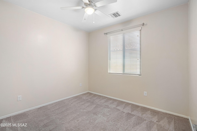 empty room with light carpet, baseboards, visible vents, and a ceiling fan