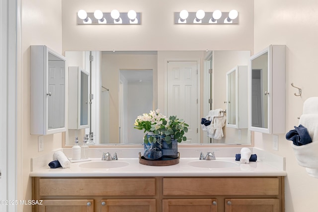 bathroom with double vanity and a sink
