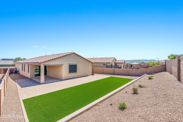 view of yard with a patio area and a fenced backyard