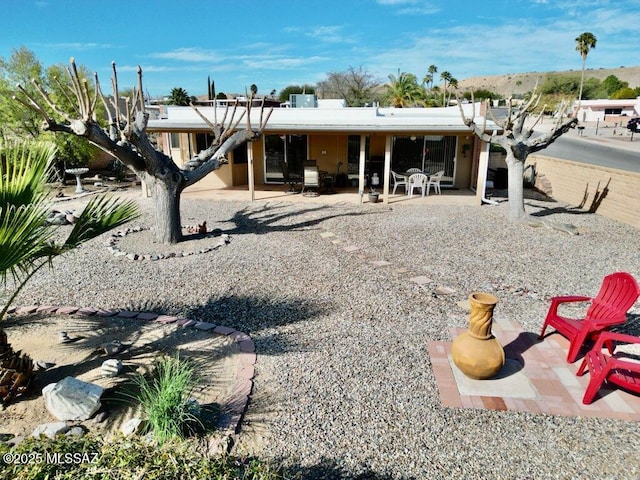 back of house featuring a patio area