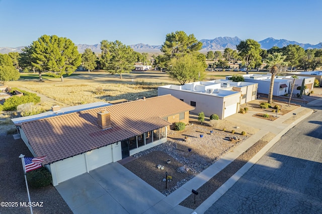 birds eye view of property with a mountain view