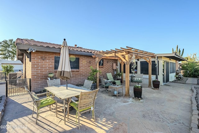 rear view of house featuring brick siding, outdoor dining area, a pergola, and a patio