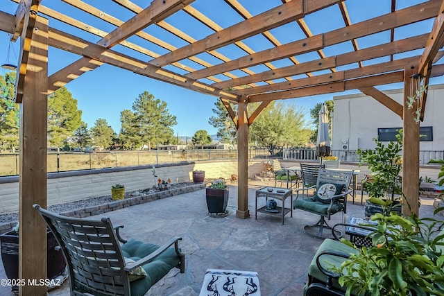 view of patio / terrace with outdoor dining area, a fenced backyard, and a pergola