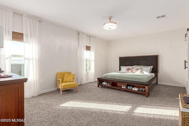 bedroom with baseboards, visible vents, and carpet flooring