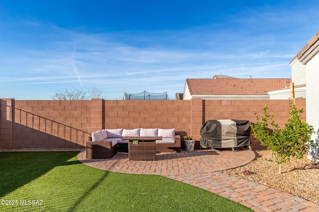 view of yard with a fenced backyard, a patio, and an outdoor hangout area