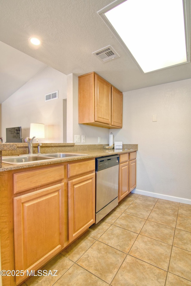 kitchen with a sink, lofted ceiling, visible vents, and stainless steel dishwasher