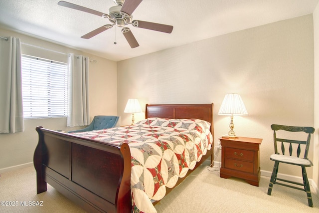 bedroom with a ceiling fan, carpet, and baseboards