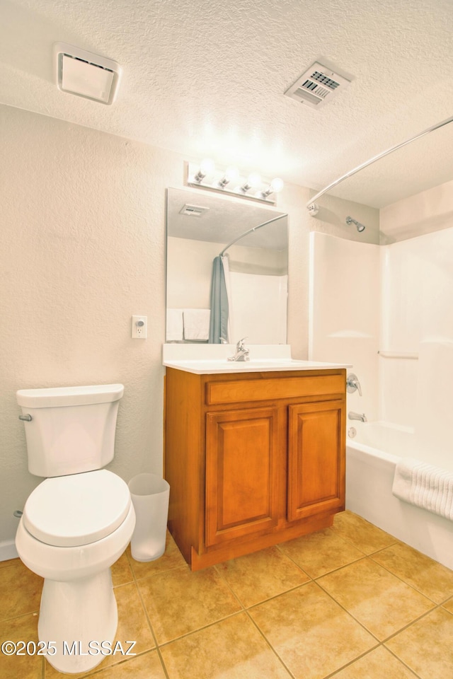 bathroom featuring vanity, toilet, shower / washtub combination, a textured ceiling, and visible vents