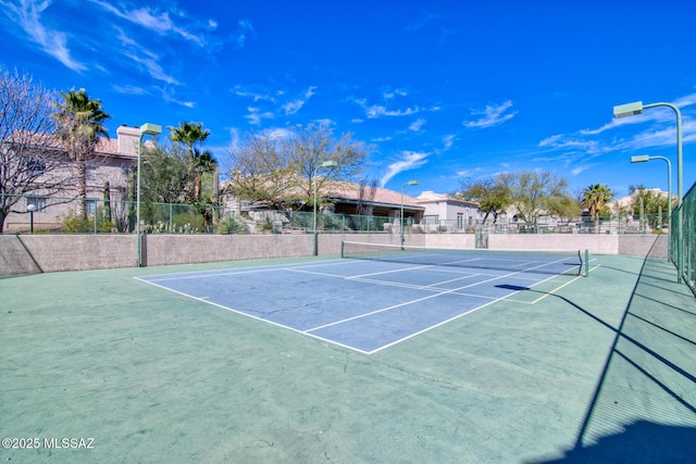 view of sport court with fence and community basketball court