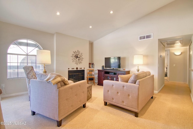 living area with baseboards, visible vents, recessed lighting, and light carpet