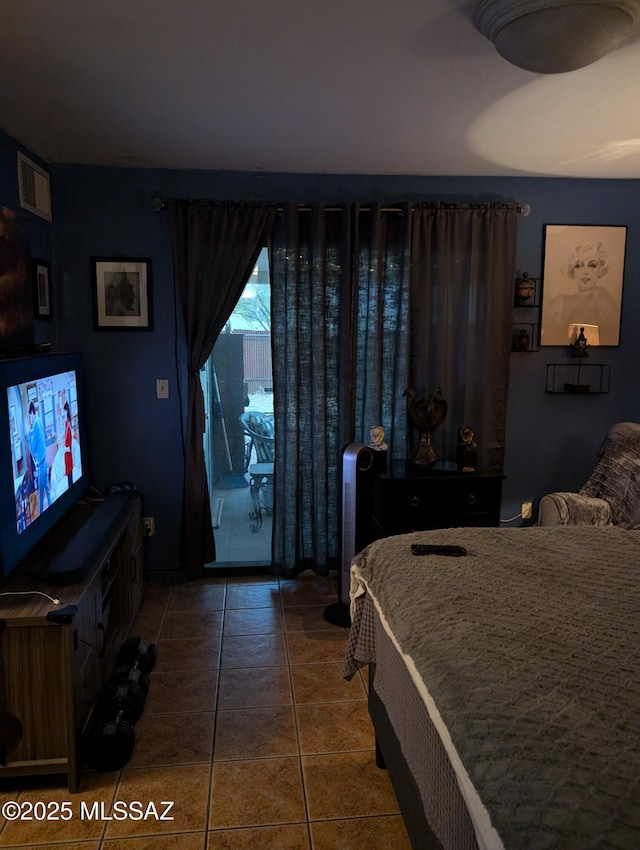 bedroom with access to outside, dark tile patterned flooring, and visible vents