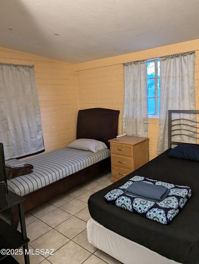 bedroom featuring light tile patterned floors