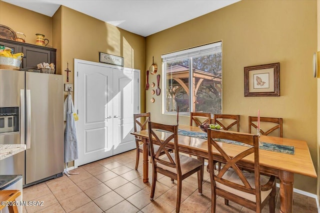 dining space with light tile patterned floors