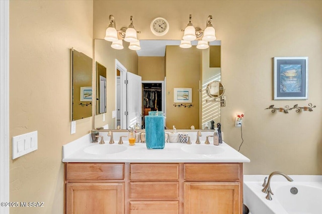 full bathroom featuring a sink, a bath, and double vanity