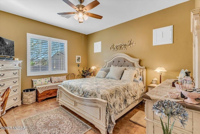 bedroom featuring light tile patterned floors and ceiling fan