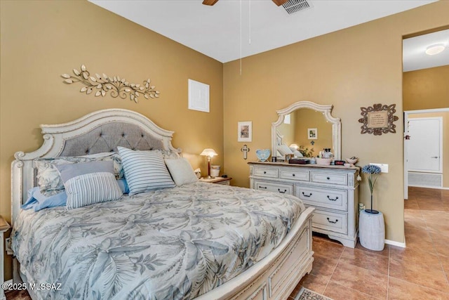 bedroom featuring light tile patterned flooring, visible vents, and baseboards