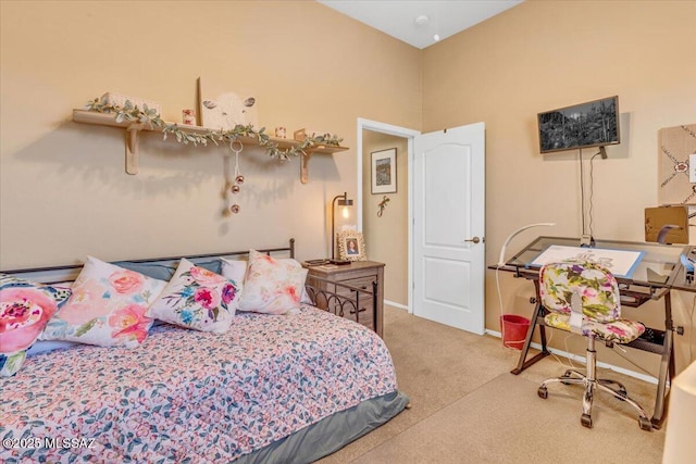 bedroom featuring carpet floors and baseboards