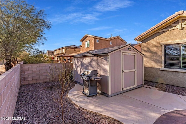 view of shed featuring a fenced backyard