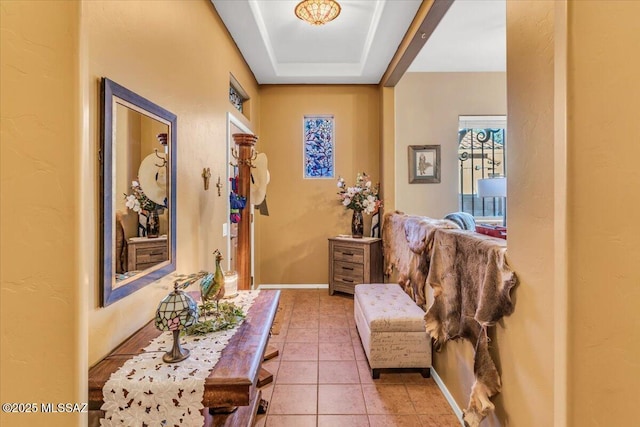 interior space featuring baseboards and light tile patterned floors
