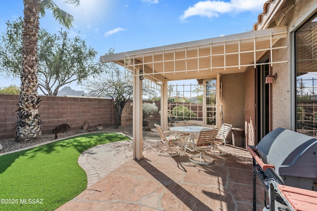 view of patio featuring grilling area and a fenced backyard