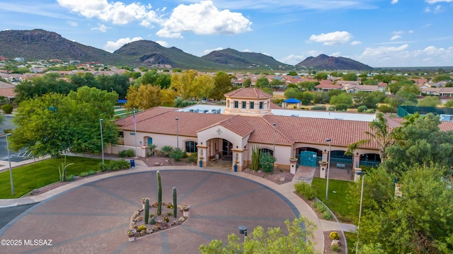 exterior space with a mountain view and aphalt driveway