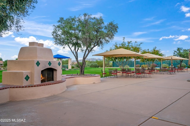 view of community featuring a patio and a lawn